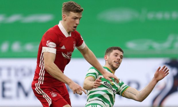 Aberdeen's Lewis Ferguson (left) and Celtic's Ryan Christie battle for the ball.