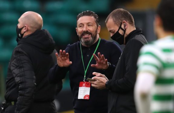 Former Aberdeen manager Derek McInnes (centre) on the touchline during the Scottish Premiership match at Celtic Park.