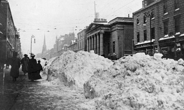 The aftermath of the great December storm of 1908 with six-foot walls of snow on Union Street.