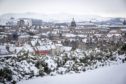 Snow covers the city of Edinburgh. Jane Barlow/PA Wire