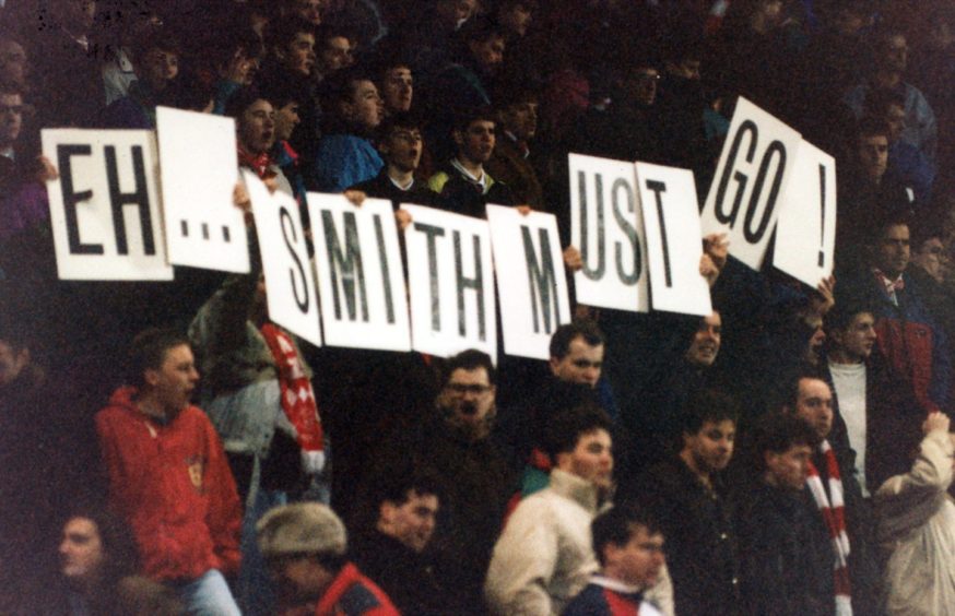 Aberdeen fans protested against Alex Smith in the final weeks of his tenure at Pittodrie, their signs read 'eh... smith must go!'