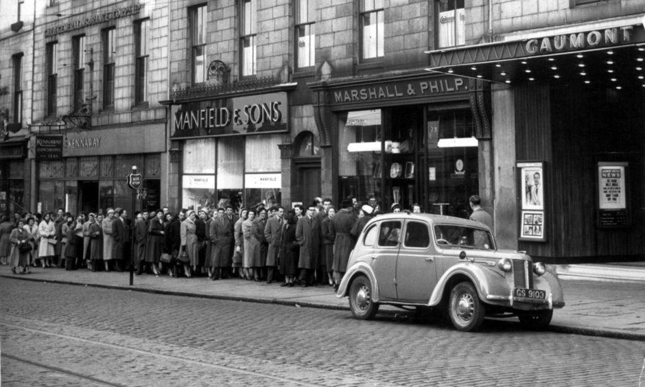 A long queue outside the The Gaumont Cinema in Union Street, Aberdeen, in 1957.