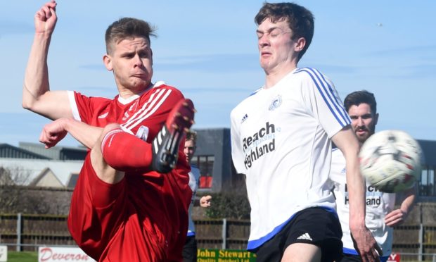 Deveronvale's Grant Noble, left, takes on Nairn's Kenny McKenzie.