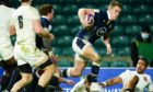 Duhan van der Merwe of Scotland drives and goes on to score the opening try