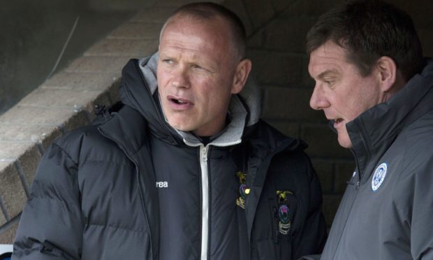 John Hughes (left) and Tommy Wright speaking before a match between Caley Thistle and St Johnstone in 2015.