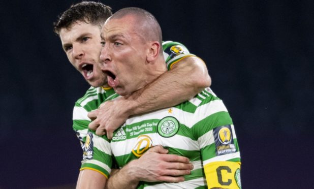 Ryan Christie (left) celebrates with Scott Brown.