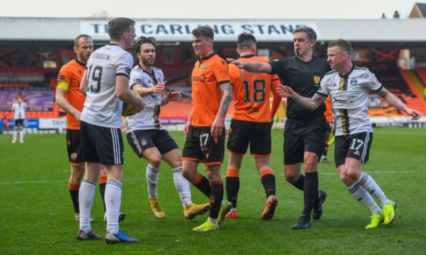 Dundee United's Jamie Robson takes issue with Aberdeen's Lewis Ferguson.