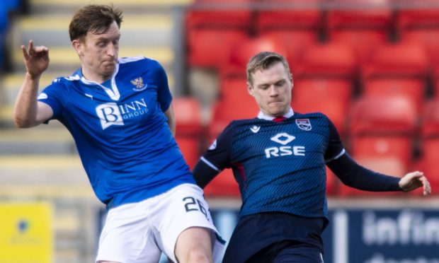 Billy Mckay contests for the ball with Liam Craig.