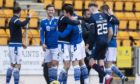 The St Johnstone players celebrate at full-time after beating Ross County on March 20 - the last time County played.