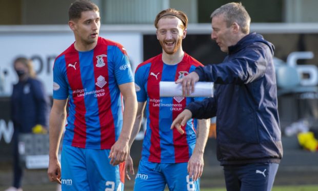 Caley Thistle midfielder David Carson with Robbie Deas and Barry Wilson.