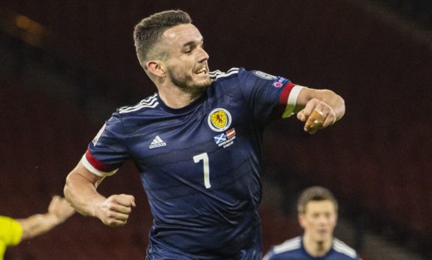 John McGinn celebrates netting for Scotland against Austria.