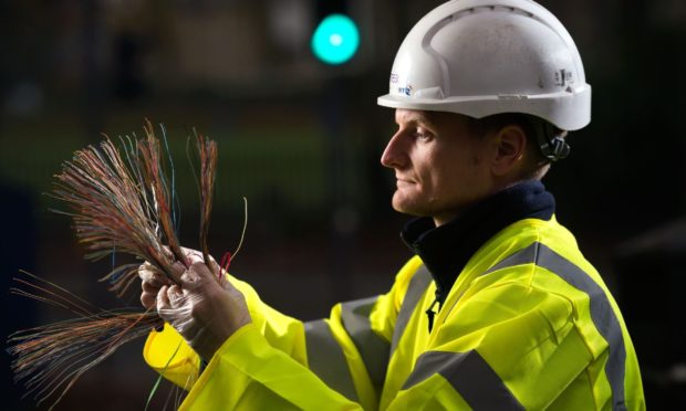 An Openreach fibre engineer connects a home to the fibre broadband network.