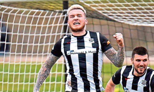 Darryl McHardy jumps for joy after scoring for Elgin City.