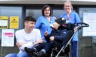 Donald Fraser, 21, with six-year-old Harris Morrison, chemotherapy practitioner Dorothy Farquharson and clinical nurse specialist oncology Karyn Ramsay.