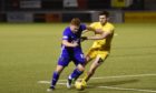 Cove midfielder Fraser Fyvie under pressure from Airdrie's Paul McKay