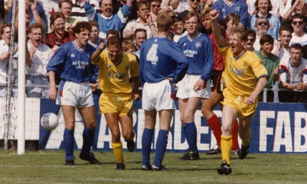 Raymond Yule, right, and Mike Megginson celebrate the former finding the net for Cove Rangers.