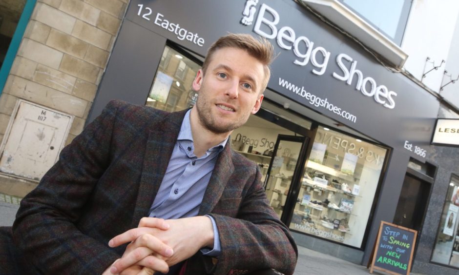 Donald Begg, outside his family's shoe shop in Inverness High Street in 2019