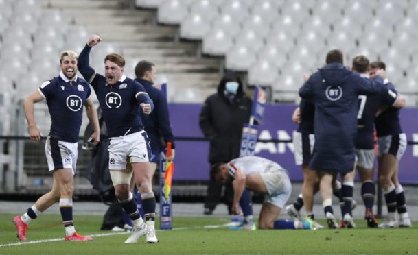 Scotland's Stuart Hogg, second left, celebrates after Scotland's Duhan Van der Merwe scored the winning try. Dobie travelled with the squad to Paris for the game.