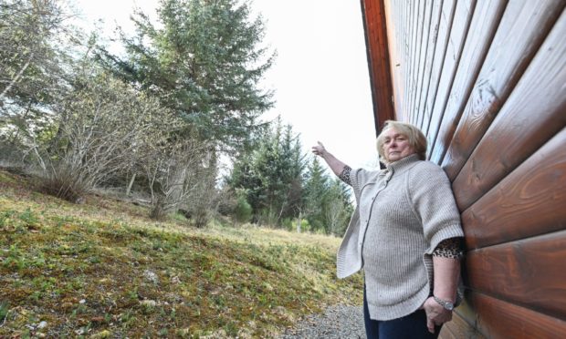 Flora Dempster who has raised safety fears over 70ft trees on the Altyre Estate falling onto her property.