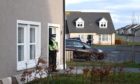 CR0027239

A baby was taken to hospital from an address on Strachan Way in Peterhead just before midday today, and police are still in attendance at the house.

Pictured is the house with the policeman on duty

Picture by Paul Glendell     23/03/2021