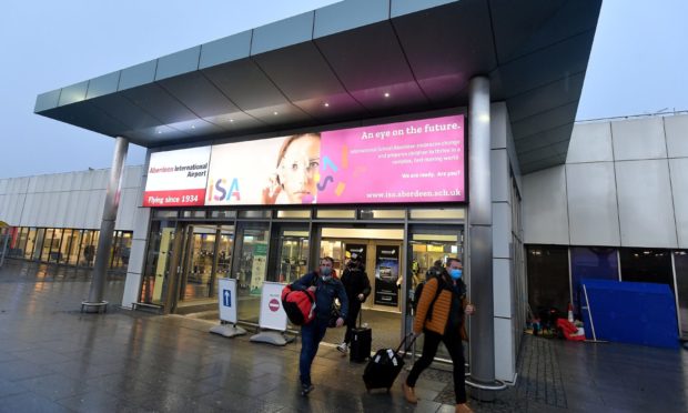 Passengers arrive from Stavanger at Aberdeen Airport, which has announced new rapid Covid testing facilities.