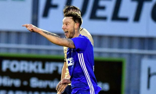 Mitch Megginson celebrates a goal against Forfar Athletic.