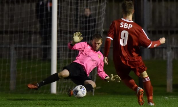 Robert Scott in action for Deveronvale against Clachnacuddin.