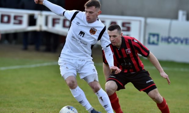 Alis Sutherland in action for Rothes against Inverurie Locos.