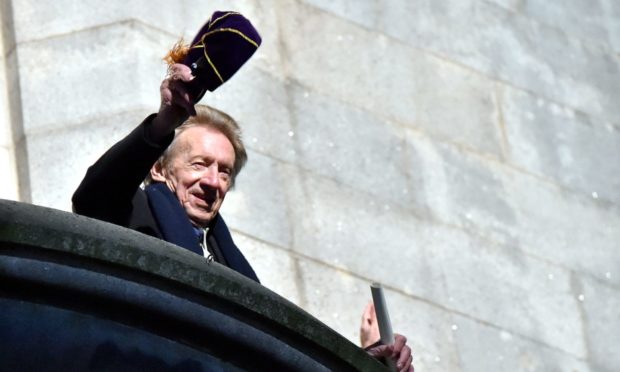 Denis Law waves to the thousands who lined the streets for his Freedom of the City parade in November 2017.