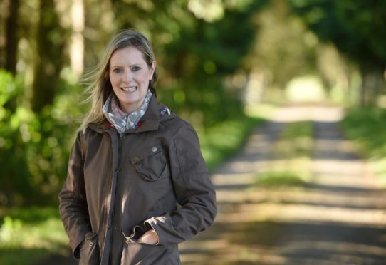 Jo at Rootfield Farm on the Black Isle, where she lives with her husband Nick, their daughters Daisy and Mollie, and 120 dairy cows.