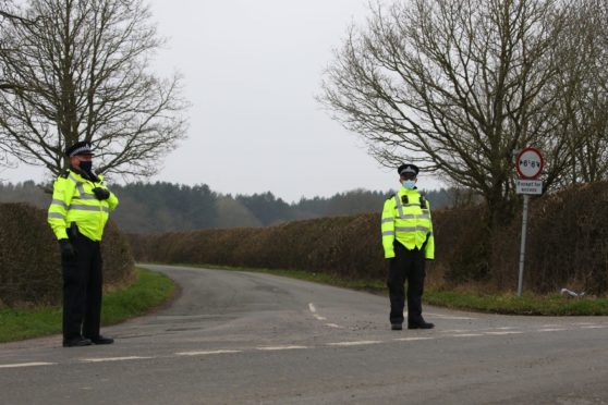 Police close off a road in Kent during the search for Sarah Everard. Gareth Fuller/PA Wire