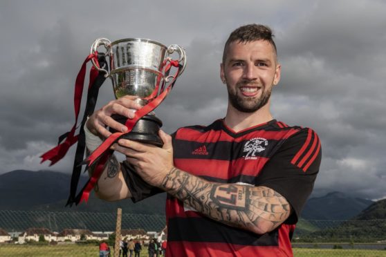 Lochside Rovers captain Jordan Kerr with the Sutherland Cup.