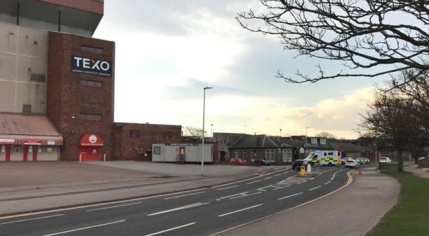 Police vehicles attend the incident on Golf Road, beside Pittodrie Stadium. Picture by Ben Hendrie