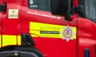 Firefighters were seen battling to control the flames, which were "well established" through the car when they arrived at the scene, south of Fyvie.
