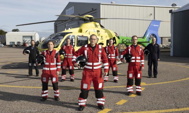 The Aberdeen-based Scaa team in front of Helimed 79 Pictured from left, pilot Jon Stupart, paramedic Laura McAllister, paramedic Chriss Doyle, lead paramedic Ewan Littlejohn, paramedic Rich Forte, paramedic Owen McLauchlan, and pilot Pete Winn