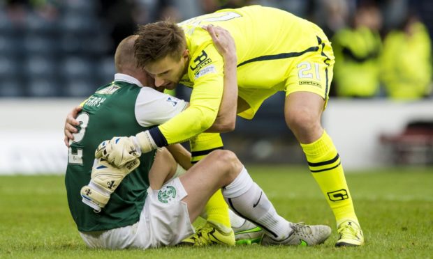 Hibernian's David Gray (left) with Ross County's Gary Woods at full-time.