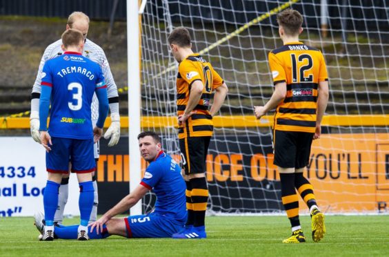 Lewis Toshney, seated, has left Caley Thistle.