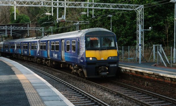 27/2/20. Pics of a Scotrail "320" model train, going through Port Glasgow train station. This is an old model of train which is still being used by Scotrail. Location: Port Glasgow.