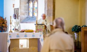 Father James Bell marks the annunciation at St Mary's church, Inverness.