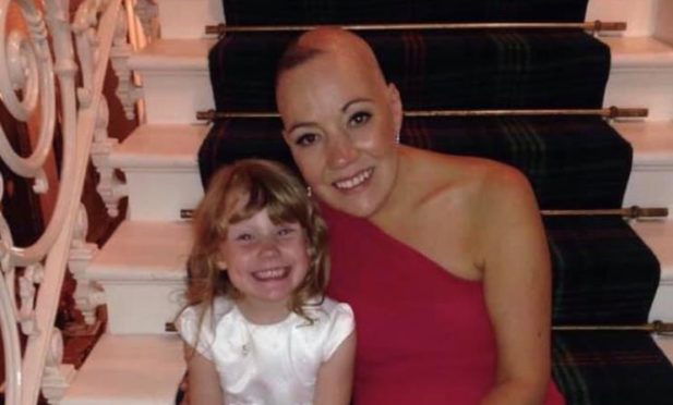Aberdeen mum-of-two Suzanne Davies after her brain tumour diagnosis. She has helped raise more than £80,000 for cancer research, seven years after being told she had a year to live.