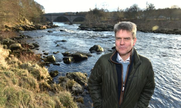 Mark Bilsby, chief executive of Atlantic Salmon Trust, on the River Dee near Banchory.