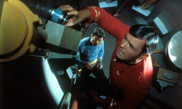 Scotty, played by James Doohan, putting his engineering skills to good use on the USS Enterprise.