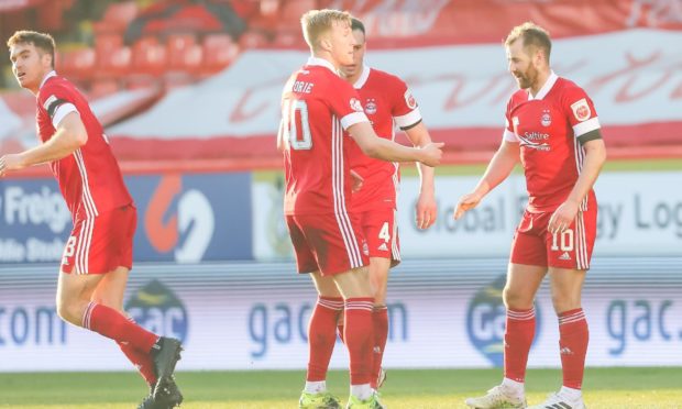 Aberdeen midfielder Niall McGinn is congratulated after his goal against Livingston.