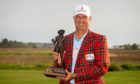 Stewart Cink holds the championship trophy after winning the final round of the RBC Heritage.