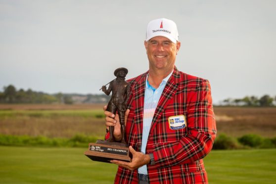 Stewart Cink holds the championship trophy after winning the final round of the RBC Heritage.