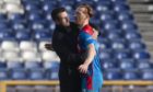 David Carson is embraced by Caley Thistle interim manager Neil McCann.