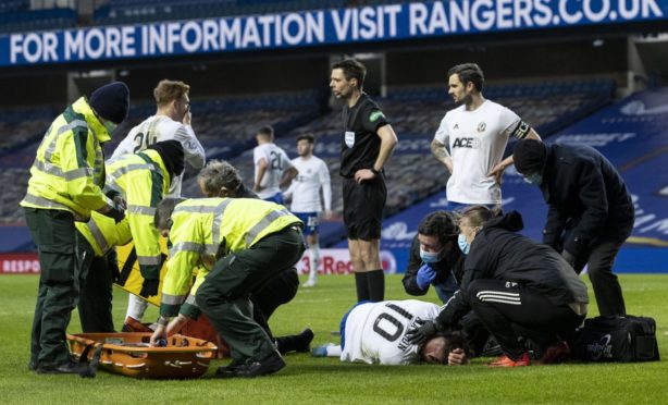 Cove Rangers midfielder Jamie Masson is tended to be paramedics.