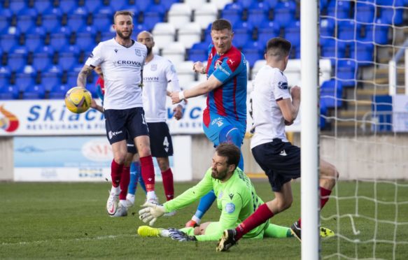 Inverness' Shane Sutherland (centre) in action against Dundee.