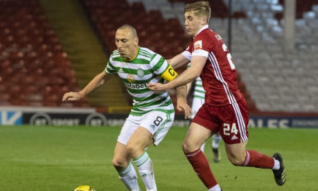 Celtic's Scott Brown (left) holds off Aberdeen's Dean Campbell.