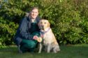 Baxter the hero Labrador with his owner Emma Tomlinson.